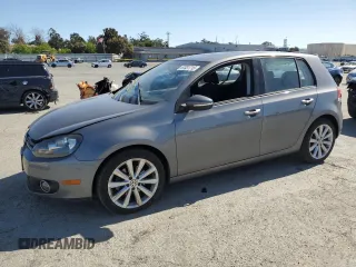 2014 Volkswagen Golf TDI w/Sunroof & Nav z VIN WVWNM7AJ2EW006137, wystawiony jako Copart lot #57031715 z przebiegiem 136 654 mil mil oraz Szkoda całkowita • Salvage title. Historia ofert i sprzedaży dostępna na DreamBid. Obrazek 1.