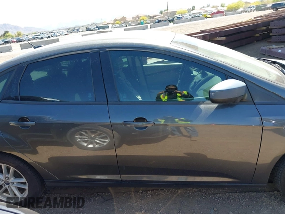 2018 Ford Focus SE with VIN 1FADP3FE6JL270910, listed as a IAAI auction lot 42130371 with 121,240 mi miles. Bid and sale history available at carsss.com. Image 13.