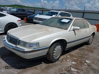 1994 Cadillac Eldorado ESC z VIN 1G6EL12Y4RU604343, wystawiony jako IAAI lot #42221885 z przebiegiem Nie podano mil oraz . Historia ofert i sprzedaży dostępna na DreamBid. Obrazek 2.