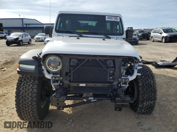 2023 Jeep Wrangler Sport S with VIN 1C4HJXDGXPW665818, listed as a Copart auction lot 48357105 with 9,803 mi miles and Clean Title. Bid and sale history available at DreamBid. Image 5.