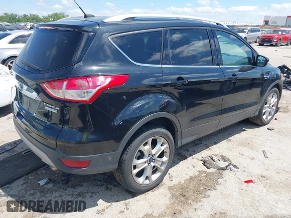 2015 Ford Escape Titanium with VIN 1FMCU0JX3FUB39808, listed as a IAAI auction lot 42212271 with 136,488 mi miles and . Bid and sale history available at DreamBid. Image 4.