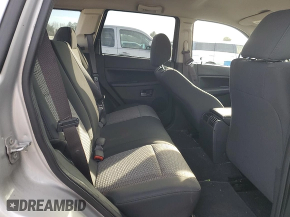 2009 Jeep Grand Cherokee Laredo with VIN 1J8HR48P89C552691, listed as a Copart auction lot 82080964 with 100,876 mi miles and Salvage Title. Bid and sale history available at carsss.com. Image 11.