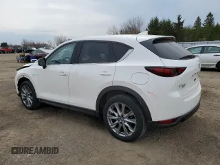 2021 Mazda CX-5 Grand Touring with VIN JM3KFBDM7M1122281, listed as a Copart auction lot 54576485 with 93,008 mi miles and Salvage Title. Bid and sale history available at DreamBid. Image 2.