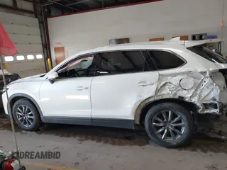 2020 Mazda CX-9 Touring z VIN JM3TCBCY8L0405360, wystawiony jako IAAI lot #41419428 z przebiegiem 69 917 mil mil oraz . Historia ofert i sprzedaży dostępna na DreamBid. Obrazek 14.