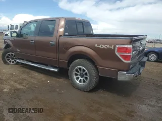 2011 Ford F-150 XLT with VIN 1FTFW1ETXBFB51042, listed as a Copart auction lot 51473695 with 179,195 mi miles and Salvage Title. Bid and sale history available at carsss.com. Image 2.