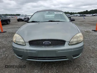 2006 Ford Taurus SE z VIN 1FAFP53U16A142612, wystawiony jako Copart lot #59805145 z przebiegiem 116 999 mil mil oraz Czysty tytuł • Clean title. Historia ofert i sprzedaży dostępna na DreamBid. Obrazek 5.