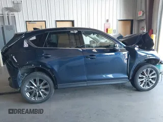 2020 Mazda CX-5 Grand Touring with VIN JM3KFBDM8L0781491, listed as a IAAI auction lot 39788385 with 57,316 mi miles and . Bid and sale history available at carsss.com. Image 13.