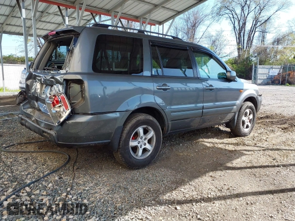 2007 Honda Pilot EX-L with VIN 5FNYF18777B012649, listed as a IAAI auction lot 42070873 with 167,419 mi miles and . Bid and sale history available at DreamBid. Image 4.