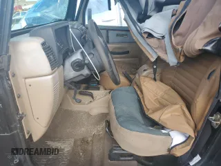 2002 Jeep Wrangler Sahara with VIN 1J4FA59SX2P747327, listed as a Copart auction lot 59515455 with 79,964 mi miles and Salvage title. Bid and sale history available at DreamBid. Image 7.