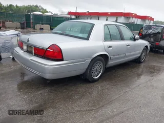 2001 Mercury Grand Marquis GS z VIN 2MEFM74W91X618246, wystawiony jako IAAI lot #42226130 z przebiegiem 125 487 mil mil oraz . Historia ofert i sprzedaży dostępna na DreamBid. Obrazek 4.