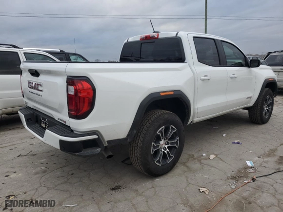 2024 GMC Canyon 4WD AT4 with VIN 1GTP6DEK7R1161063, listed as a Copart auction lot 82523764 with 6,069 mi miles and Salvage Title. Bid and sale history available at carsss.com. Image 3.