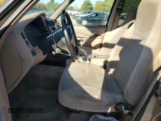 1999 Ford Explorer XL with VIN 1FMZU34X2XUA28059, listed as a Copart auction lot 77668294 with 131,064 mi miles and Salvage title. Bid and sale history available at DreamBid. Image 7.