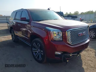 2017 GMC Yukon Denali with VIN 1GKS1CKJ4HR141145, listed as a IAAI auction lot 40799652 with 104,369 mi miles. Bid and sale history available at carsss.com. Image 1.