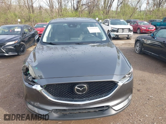 2020 Mazda CX-5 Touring with VIN JM3KFBCM8L0863951, listed as a IAAI auction lot 41921635 with 88,629 mi miles. Bid and sale history available at carsss.com. Image 12.