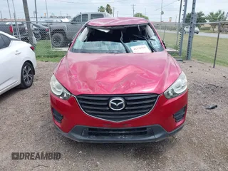 2016 Mazda CX-5 Sport with VIN JM3KE2BYXG0668401, listed as a IAAI auction lot 42370910 with Not provided miles and . Bid and sale history available at DreamBid. Image 6.