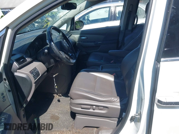 2014 Honda Odyssey Touring with VIN 5FNRL5H94EB071788, listed as a IAAI auction lot 42523959 with 244,734 mi miles and . Bid and sale history available at DreamBid. Image 5.