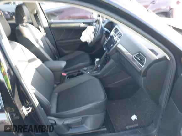 2023 Volkswagen Tiguan SE with VIN 3VVMB7AX8PM032557, listed as a IAAI auction lot 41585975 with 28,706 mi miles and . Bid and sale history available at DreamBid. Image 5.