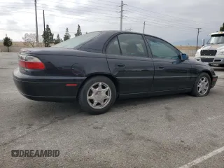 1997 Cadillac Catera z VIN W06VR52RXVR092016, wystawiony jako Copart lot #54067575 z przebiegiem 63 978 mil mil oraz Tytuł czysty. Historia ofert i sprzedaży dostępna na DreamBid. Obrazek 3.