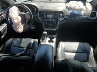2017 Jeep Grand Cherokee Overland with VIN 1C4RJFCT5HC777748, listed as a Copart auction lot 63121635 with 106,991 mi miles and Salvage title. Bid and sale history available at DreamBid. Image 8.