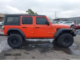 2019 Jeep Wrangler Unlimited Sport S with VIN 1C4HJXDG7KW568441, listed as a IAAI auction lot 41142271 with 73,698 mi miles and . Bid and sale history available at DreamBid. Image 14.