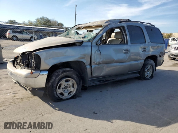 2000 GMC Yukon SLE with VIN 1GKEK13T2YJ130870, listed as a Copart auction lot 82887054 with 310,765 mi miles and Salvage Title. Bid and sale history available at carsss.com. Image 1.