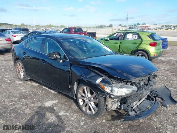 2017 Mazda Mazda6 Touring with VIN JM1GL1V52H1128973, listed as a IAAI auction lot 41661300 with 131,721 mi miles. Bid and sale history available at carsss.com. Image 1.