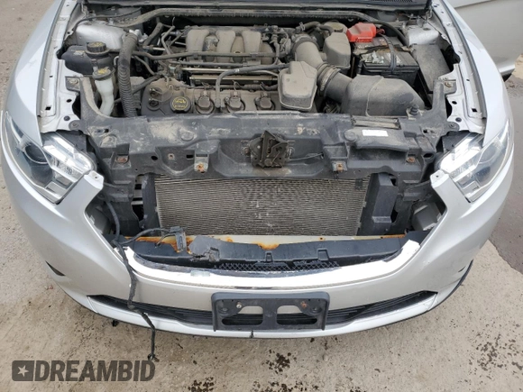 2017 Ford Taurus SEL z VIN 1FAHP2E87HG119780, wystawiony jako Copart lot #59135705 z przebiegiem 122 731 mil mil oraz Szkoda całkowita • Salvage title. Historia ofert i sprzedaży dostępna na DreamBid. Obrazek 11.