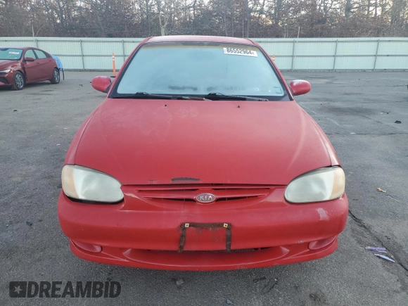 2001 Kia Sephia z VIN KNAFB121715066725, wystawiony jako Copart lot #86552964 z przebiegiem 76 915 mil mil oraz Tytuł czysty. Historia ofert i sprzedaży dostępna na DreamBid. Obrazek 5.