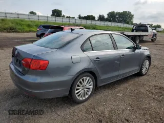 2014 Volkswagen Jetta TDI w/Premium with VIN 3VWLL7AJ6EM428743, listed as a Copart auction lot 63459355 with 145,814 mi miles and Salvage title. Bid and sale history available at DreamBid. Image 3.