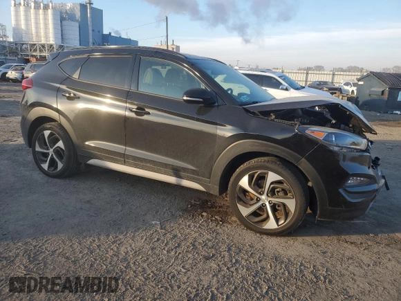 2017 Hyundai Tucson Sport with VIN KM8J3CA25HU572940, listed as a Copart auction lot 87414304 with 56,854 mi miles and Salvage Title. Bid and sale history available at DreamBid. Image 4.
