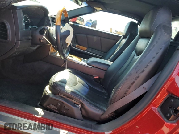 2004 Cadillac XLR z VIN 1G6YV34A345600127, wystawiony jako Copart lot #68859774 z przebiegiem 40 727 mil mil oraz Szkody całkowita. Historia ofert i sprzedaży dostępna na DreamBid. Obrazek 7.
