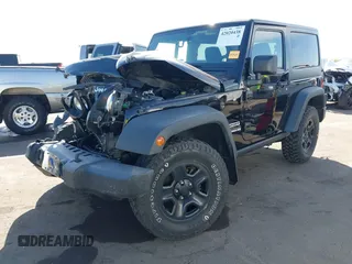2014 Jeep Wrangler Sport with VIN 1C4AJWAG7EL100344, listed as a IAAI auction lot 42020438 with 87,279 mi miles and . Bid and sale history available at carsss.com. Image 2.