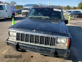 1996 Jeep Cherokee z VIN 1J4FN78S8TL160974, wystawiony jako Copart lot #83425604 z przebiegiem 336 313 mil mil oraz Szkoda całkowita • Salvage title. Historia ofert i sprzedaży dostępna na DreamBid. Obrazek 11.