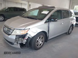 2012 Honda Odyssey EX-L with VIN 5FNRL5H67CB005013, listed as a IAAI auction lot 42295586 with 200,611 mi miles and . Bid and sale history available at DreamBid. Image 2.