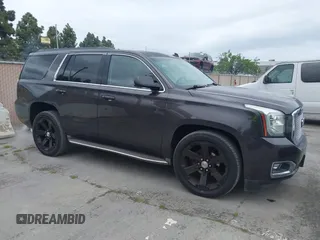 2015 GMC Yukon SLT with VIN 1GKS1BKC6FR245564, listed as a IAAI auction lot 42139295 with 149,088 mi miles. Bid and sale history available at carsss.com. Image 1.