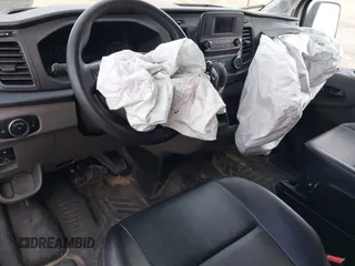 2024 Ford Transit Cargo z VIN 1FTBR1C84RKA32473, wystawiony jako IAAI lot #42438142 z przebiegiem 40 817 mil mil oraz . Historia ofert i sprzedaży dostępna na DreamBid. Obrazek 18.
