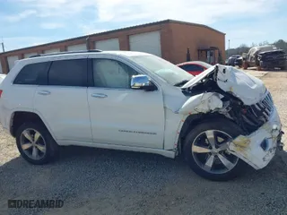 2014 Jeep Grand Cherokee Overland with VIN 1C4RJFCT6EC126897, listed as a IAAI auction lot 41826773 with 115,251 mi miles. Bid and sale history available at carsss.com. Image 13.