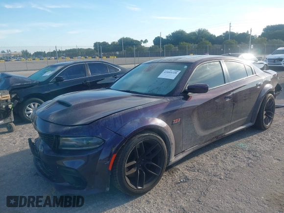 2021 Dodge Charger Scat Pack Widebody with VIN 2C3CDXGJXMH559036, listed as a IAAI auction lot 41895328 with 55,017 mi miles and . Bid and sale history available at DreamBid. Image 2.