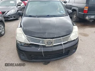 2009 Nissan Versa 1.8 SL with VIN 3N1BC13E59L496882, listed as a IAAI auction lot 41798734 with 210,907 mi miles. Bid and sale history available at carsss.com. Image 12.