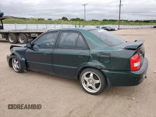 2002 Mazda Protege LX z VIN JM1BJ226920510014, wystawiony jako Copart lot #59285995 z przebiegiem 235 652 mil mil oraz Szkoda całkowita • Salvage title. Historia ofert i sprzedaży dostępna na DreamBid. Obrazek 2.