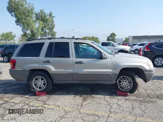 2004 Jeep Grand Cherokee Laredo with VIN 1J4GX48N24C334983, listed as a IAAI auction lot 42522088 with 169,793 mi miles and . Bid and sale history available at DreamBid. Image 13.