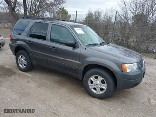 2003 Ford Escape XLT Popular 2 with VIN 1FMYU93103KA39840, listed as a IAAI auction lot 41966605 with 141,321 mi miles. Bid and sale history available at carsss.com. Image 1.