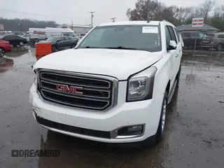 2015 GMC Yukon XL SLT with VIN 1GKS1HKC7FR223513, listed as a IAAI auction lot 40822575 with 128,239 mi miles. Bid and sale history available at carsss.com. Image 2.