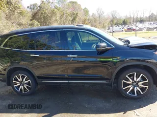 2022 Honda Pilot Touring 7-Passenger with VIN 5FNYF6H65NB030018, listed as a IAAI auction lot 41774147 with 57,391 mi miles. Bid and sale history available at carsss.com. Image 13.
