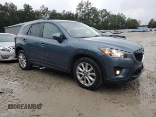2015 Mazda CX-5 Grand Touring with VIN JM3KE2DY4F0526671, listed as a Copart auction lot 46520505 with 129,017 mi miles and Salvage Title. Bid and sale history available at carsss.com. Image 4.