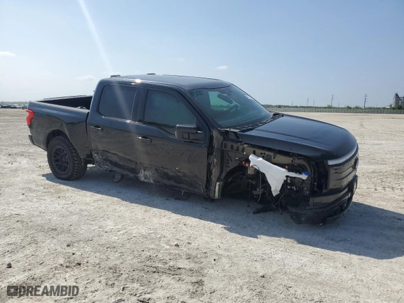 2023 Ford F-150 Lightning Pro with VIN 1FT6W1EV1PWG09284, listed as a Copart auction lot 49773755 with 15,207 mi miles and Salvage Title. Bid and sale history available at carsss.com. Image 4.