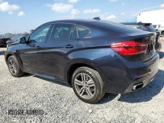 2015 BMW X6 xDrive50i with VIN 5UXKU6C50F0F94199, listed as a Copart auction lot 70680312 with 106,650 mi miles. Bid and sale history available at carsss.com. Image 2.