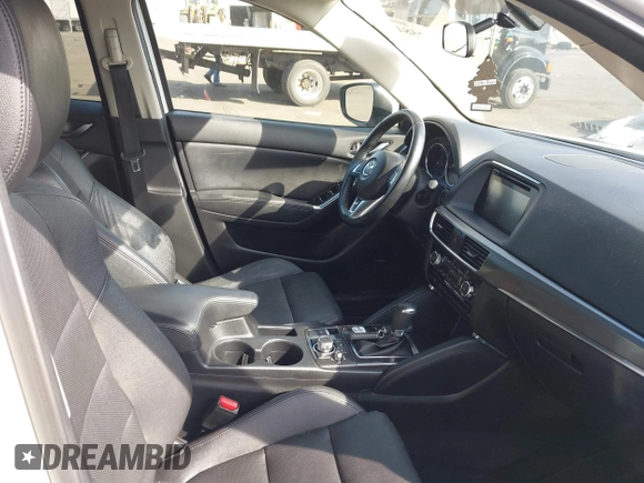 2016 Mazda CX-5 Grand Touring with VIN JM3KE4DYXG0836692, listed as a IAAI auction lot 41812584 with 119,302 mi miles. Bid and sale history available at carsss.com. Image 5.