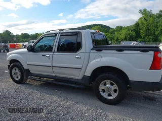 2003 Ford Explorer Sport Trac XLS z VIN 1FMZU77E33UA26042, wystawiony jako IAAI lot #42524905 z przebiegiem 124 878 mil mil oraz . Historia ofert i sprzedaży dostępna na DreamBid. Obrazek 14.