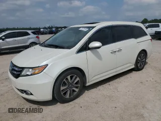 2015 Honda Odyssey Touring Elite with VIN 5FNRL5H94FB128220, listed as a Copart auction lot 51073145 with 107,079 mi miles and Salvage title. Bid and sale history available at DreamBid. Image 1.